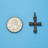 Cross size next to a Quarter