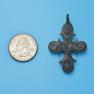 Cross size next to a Quarter