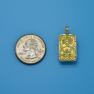 Pendant size next to a Quarter