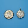 Pendant size next to a Quarter