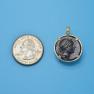 Pendant size next to a Quarter
