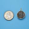 Pendant size next to a Quarter