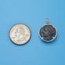 Pendant size next to a Quarter