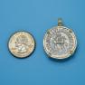 Pendant size next to a Quarter