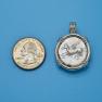 Pendant size next to a Quarter