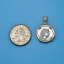 Pendant size next to a Quarter