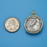 Pendant size next to a Quarter