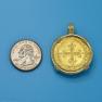 Pendant size next to a Quarter