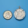 Pendant size next to a Quarter