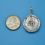 Pendant size next to a Quarter