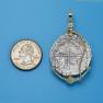 Pendant size next to a Quarter