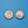 Pendant size next to a Quarter