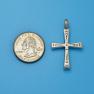 Cross size next to a Quarter