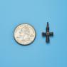 Cross size next to a Quarter