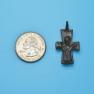Cross size next to a Quarter