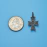 Cross size next to a Quarter