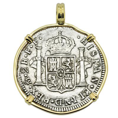 El Cazador treasure coin in gold pendant