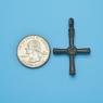 Cross size next to a Quarter
