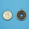 Pendant size next to a Quarter