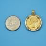 Pendant size next to a Quarter