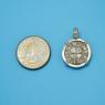 Pendant size next to a Quarter