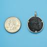 Pendant size next to a Quarter