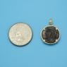 Pendant size next to a Quarter