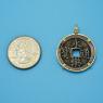 Pendant size next to a Quarter