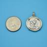 Pendant size next to a Quarter