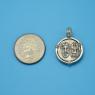 Pendant size next to a Quarter