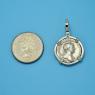 Pendant size next to a Quarter