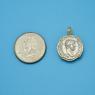 Pendant size next to a Quarter