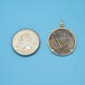 Pendant size next to a Quarter