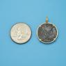 Pendant size next to a Quarter