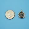 Pendant size next to a Quarter