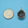 Pendant size next to a Quarter