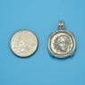 Pendant size next to a Quarter