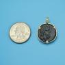 Pendant size next to a Quarter