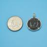 Pendant size next to a Quarter