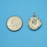 Pendant size next to a Quarter