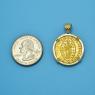 Pendant size next to a Quarter
