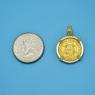 Pendant size next to a Quarter