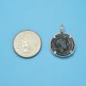 Pendant size next to a Quarter