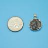 Pendant size next to a Quarter