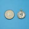 Pendant size next to a Quarter