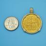 Pendant size next to a Quarter