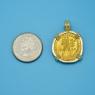 Pendant size next to a Quarter