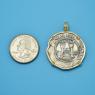 Pendant size next to a Quarter