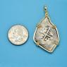 Pendant size next to a Quarter