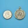 Pendant size next to a Quarter